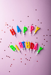 Word happy birthday and glitters from above