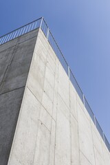 Detail of building facade. Beautiful sunny weather. Shadow play. Traditional building. Blue sky.