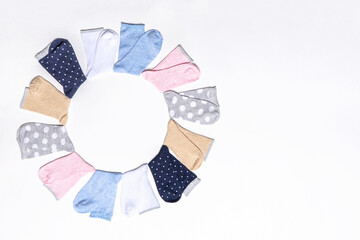 Various modern trendy women's cotton socks set on white background. Fashionable socks store. Socks shopping, sale, merchandise, advertisement concept. Flat lay, top view, copy space