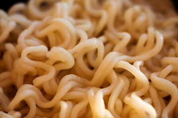 Instant noodles close-up. Spaghetti and pasta with sauce. Healthy food.
