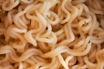 Instant noodles close-up. Spaghetti and pasta with sauce. Healthy food.