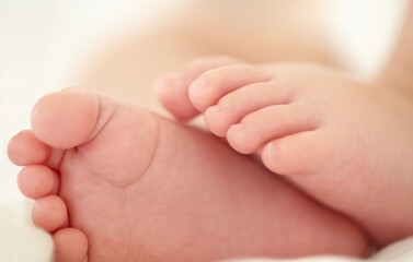 Obraz na płótnie Canvas Soon these little feet will pitter-patter around the house. Cropped image of a babys feet.