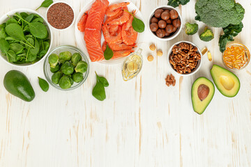 Healthy foods on white wooden background. Top view, copy space