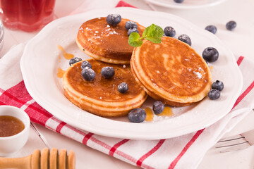 Pancakes with blueberries and chocolate cream.