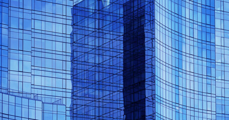 close up on modern office building with blue glass wall