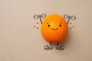 Orange with dumbbells. A symbol of a healthy snack for cheerfulness and health