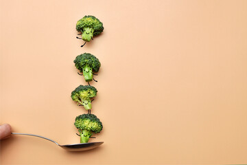 Funny little broccoli on a spoon. The joy of eating healthy food