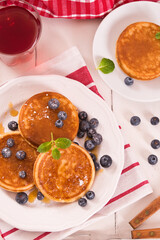 Pancakes with blueberries and chocolate cream.