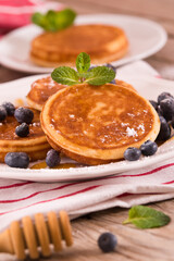 Pancakes with blueberries and chocolate cream.