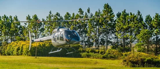 Selbstklebende Fototapete Hubschrauber Helicopter Landing at Countryside Landscape