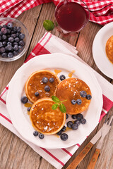 Pancakes with blueberries and chocolate cream.