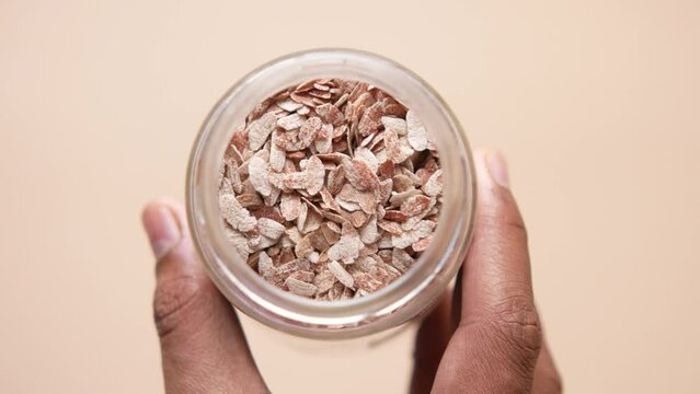 red Flattened rice in a bowl on gray background 