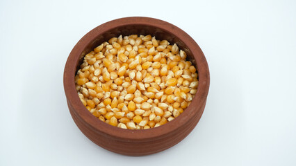 popcorn kernels in clay pot, corns, isolated corns