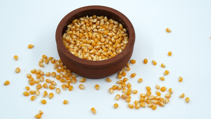 popcorn kernels in clay pot, corns, isolated corns