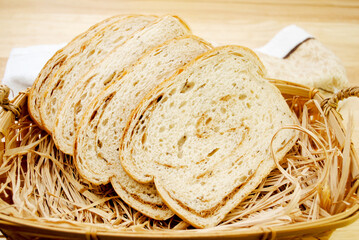 Rye & Pumpernickel Swirled Loaf of Bread in a Breadbasket