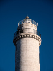 Fototapeta na wymiar Murano Lighthouse Faro dell'Isola di Murano in the Lagoon of Venice, Italy in White Stone with Double Balcony and Lantern