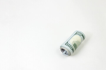 International money 100 dollar bills, twisted in roll.