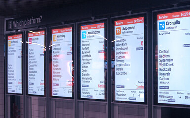 Illuminated platform and train signage at a station
