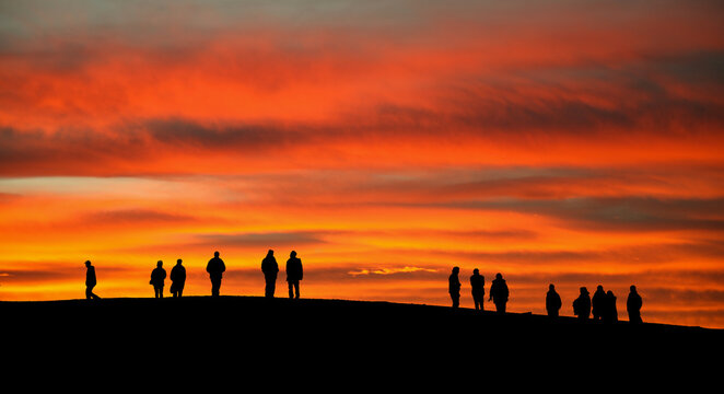 Silhouette of people over sunset sky - Aberdeen - Scotland - UK - Composite image made from 2567 and 2570