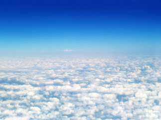 Naklejka na ściany i meble White clouds against a blue sky. White cumulonimbus clouds floating in the blue sky.