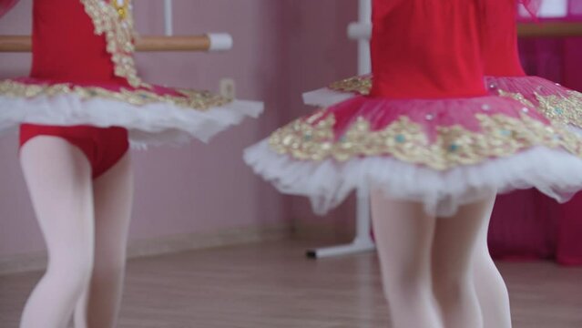 Ballet training - three little ballet girls standing in position and walking in a circle
