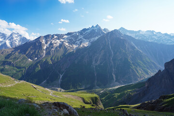 Panorama of the Altai Mountains and meadows covered with lush grass