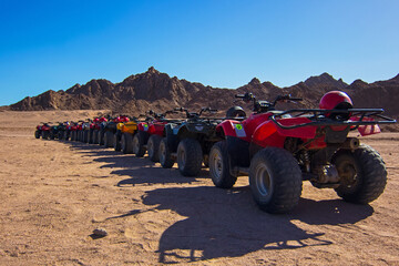 ATVs on Egyptian sand desert near mountains. Quad bike in Nabq protected area, Sharm El Sheikh,...