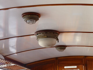 Ceiling lamps in a wagon of the historic "tren (ferrocarril) de soller" (train (railway) from Soller), Mallorca, Balearic Islands, Spain,