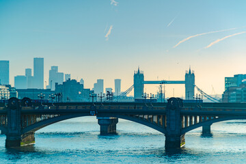 Fototapeta na wymiar Looking along the Thames in London towards Tower Bridge at Sunrise