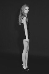 Style and attitude. Full length shot of a gorgeous young woman standing in the studio.