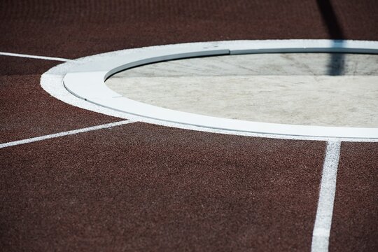 Shot Put and hammer ring. Athletic stadium. Beautiful sunny weather.