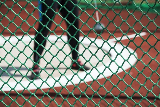 Green Protection Network. Shot Put and hammer ring. Athletic stadium. Beautiful sunny weather.