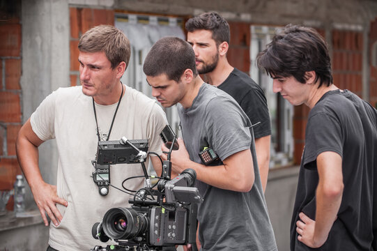 Behind scenes. Film crew team shooting movie scene. Group filmmaking