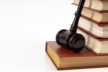 Law concept - law book with a wooden judge's gavel on table. Copy space for text