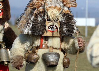 Masquerade festival in Elin Pelin, Bulgaria. People with mask called Kukeri dance and perform to...