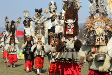 Masquerade festival in Elin Pelin, Bulgaria. People with mask called Kukeri dance and perform to...