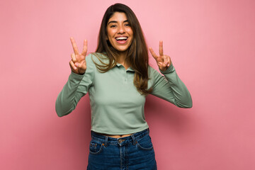 Relaxed woman making a peace gesture