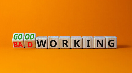 Good or bad working symbol. Turned wooden cubes and changed words bad working to good working. Beautiful orange table orange background. Business good or bad working concept, copy space.