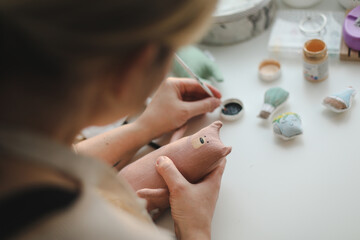 Obraz na płótnie Canvas process of making handmade toys. Handicraft, hobby, unique job concept
