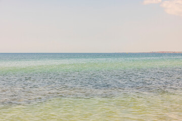 Gorgeous seascape view. Turquoise water surface merging sky on background. Greece. 