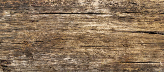 Fototapeta premium The background looks like an old cracked board with splinters and stains.