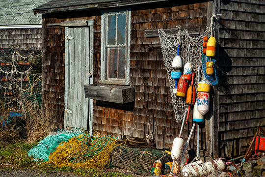 A lobster fishing shack with colorful floats hanging in front