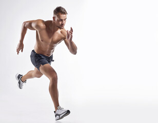 Take a step forward into your fitness journey. Shot of an athletic young man against a white background.