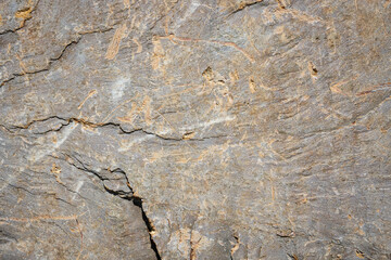 a brown stone background with random scratches