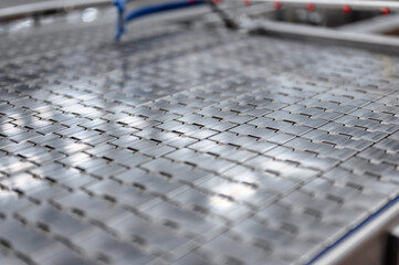 Industrial metal conveyor belt. The tape consists of metal plates