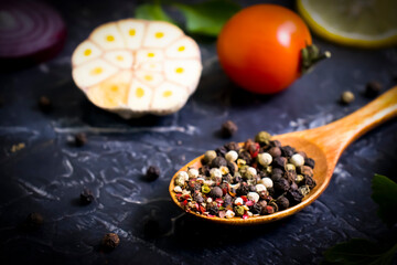 spice pepper in a spoon on a dark background