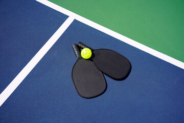 Pickle ball paddle on pickle ball court