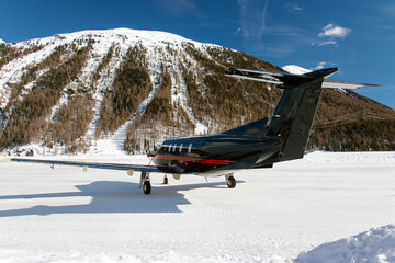 A private jet landing at the Engadine St Moritz airport