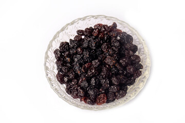 Dried currants on the white background