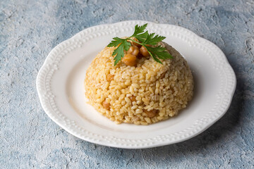 Traditional delicious Turkish food; bulgur pilaf with chickpea (Turkish name; nohutlu bulgur pilavi)